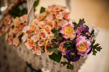 Beautiful bouquet of bright flowers in basket