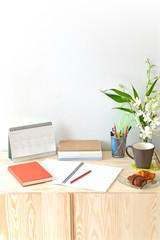 Home office table with stationary and coffee