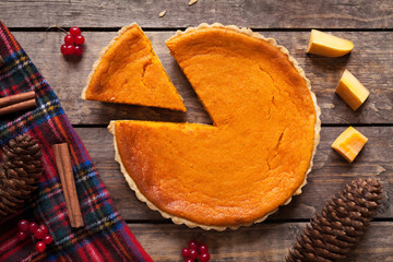 Homemade sliced pumpkin tart pie recipe with cinnamon and nuts