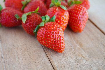 Fresh strawberries on wooden table