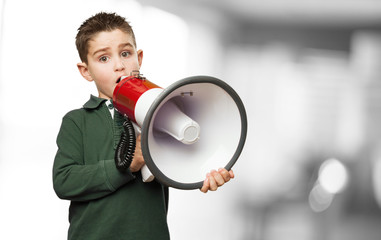 little kid holding a megaphone