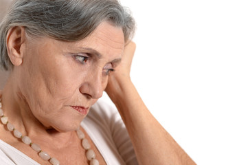 Fototapeta premium Thoughtful elderly woman