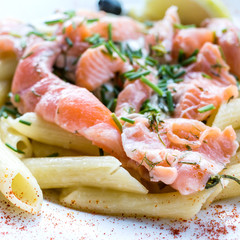 tasty pasta with salmon on a the table