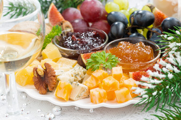 delicacy cheese and fruit plate, closeup