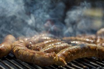 Homemade sausages on barbeque