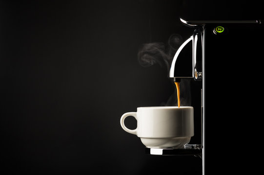 Preparing a cup of espresso coffee