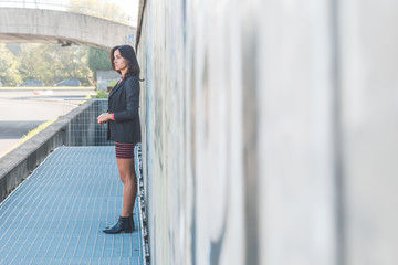 Beautiful girl posing in an urban context