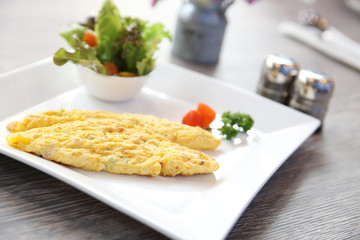 omelette on wood background