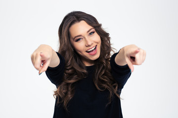 Portrait of a cheerful woman pointing at camera - obrazy, fototapety, plakaty