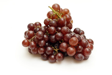 Bunch of red grapes isolated on white background.