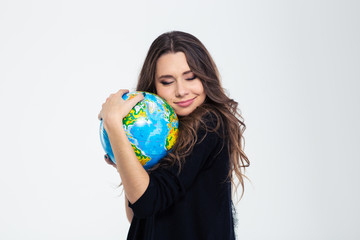 Portrait of a happy cute woman hugging globe