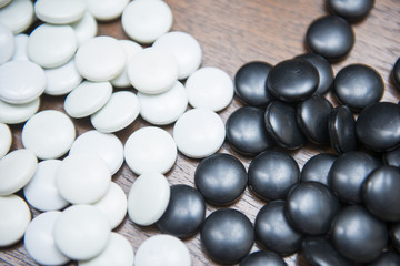 many black and white stones for go game playing