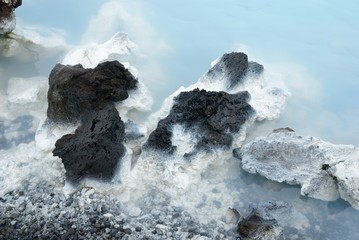 Close up on blue lagoon geological black rock 