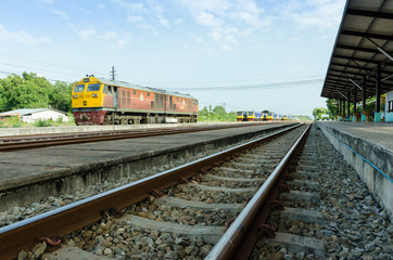 Fototapeta na wymiar Trains and railway tracks in the daytime.