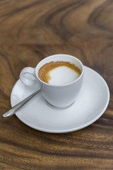 hot coffee in mug  on wood background