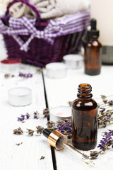 Dry lavender and oil  on a white wooden table