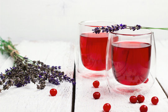 Cranberry (red berries) drink in glass