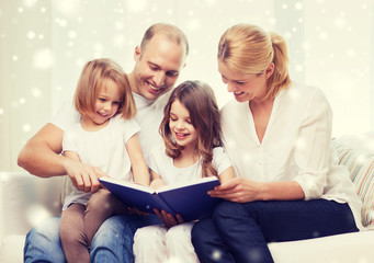 happy family with book at home