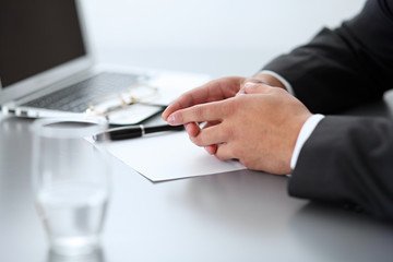 Close-up of male hands with pen over document,  business concept