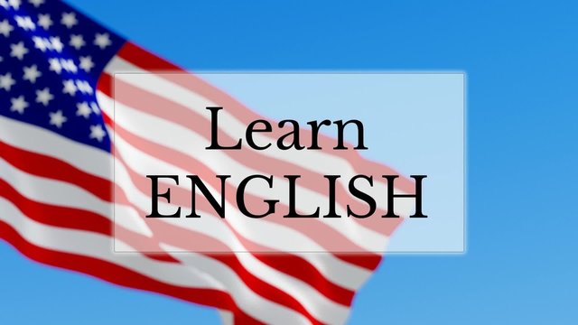 Learn English text w/ British flag background. Learn English language concept