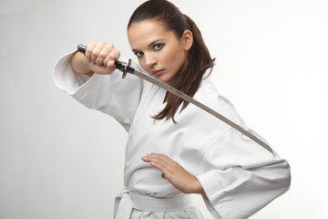 Attractive young sexy women with samurai sword