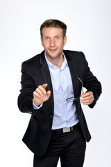 Business man with pointing to something or touching a touch screen on white background..