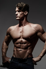 Obraz na płótnie Canvas Handsome muscular man posing.