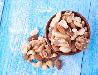 Fototapeta premium Mix nuts on wooden background
