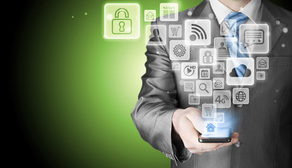 Business man using smart phone with social media icon set