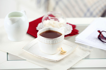 Cup of tea on table in living room