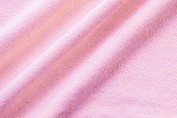 Fototapeta na wymiar Closeup wrinkled pink napkin fabric background