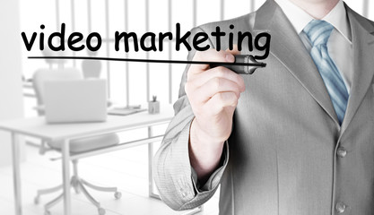 business man writing Video Marketing