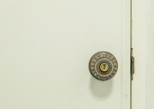 Closeup Old Door Knob At White Door Of Toilet