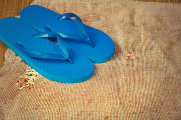 Grunge sacking background with flip flop sandals