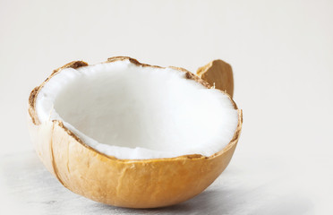 Coconut cut open isolated on white background
