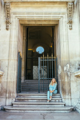 Fototapeta na wymiar Beautiful young woman in Paris, near the louvre