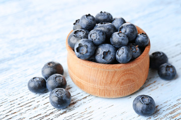 Fresh blueberries in bowl on table close up