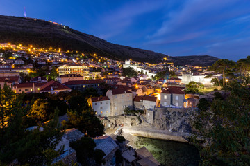 Fototapeta na wymiar View of Mount Srd and the city of Dubrovnik in Croatia at dusk.