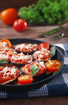 Baked vegetables in pan on table, close-up