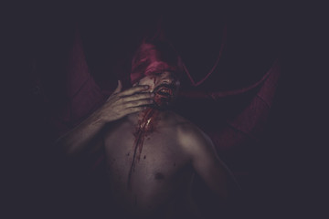 Fantasy, naked man on large red cloth over his eyes