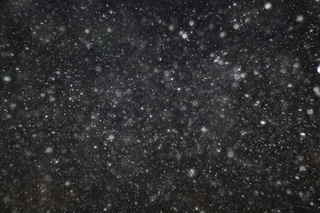 texture of white rain drops on a black background for a filter on the photo