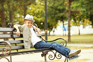 Little boy on bench in the park