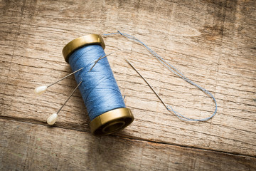 needle and blue thread