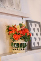 Beautiful rose in vase on shelf