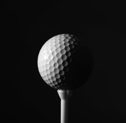 Golf ball on dark background