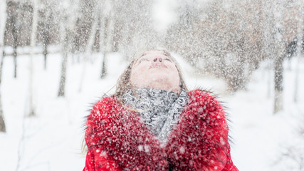 Pretty young girl with snow