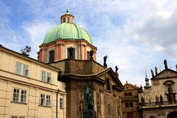 Naklejka premium Knights of the Cross Square with statue of Charles IV and St. Francis of Assisi Church near the Charles Bridge, Prague