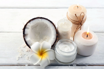 Fototapeta na wymiar Spa coconut products on light wooden background