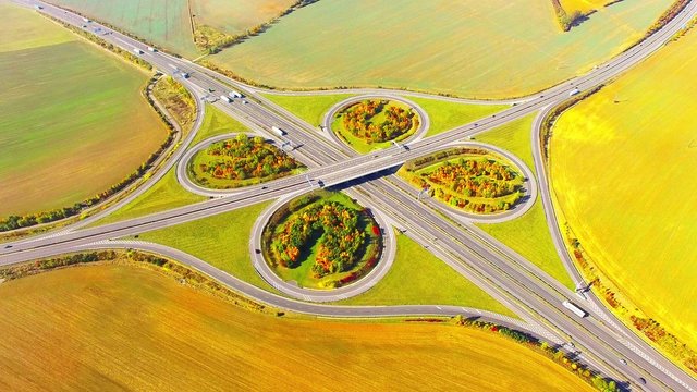Aerial view to traffic on highway D5 interchange nearby Pilsen, Czech republic, Central Europe. Transportation in rural landscape. Environmental concept. 