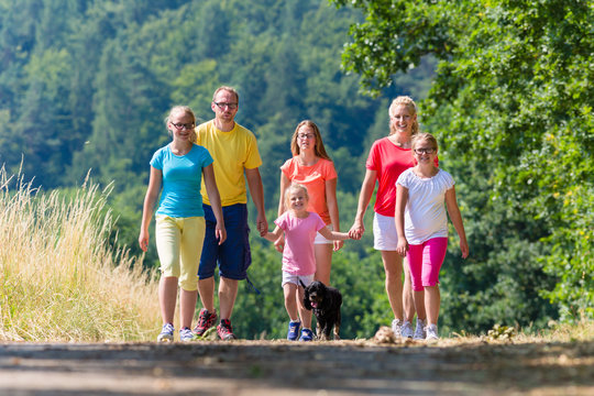 Family having walk on path in the woods